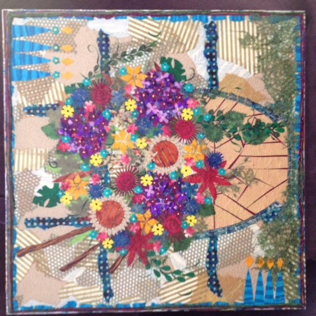 A vibrantly colorful painting of flowers on a table as part of the mixed media art exhibit Colors of the Island.