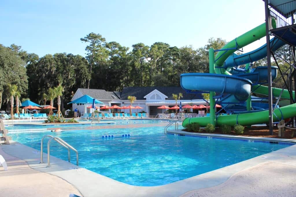 A curly slide twists into a resort-style pool at one of the clubhouses.