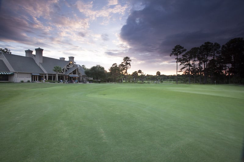 The clubhouse and lush lawn at The Landings' Golf & Athletic Club.