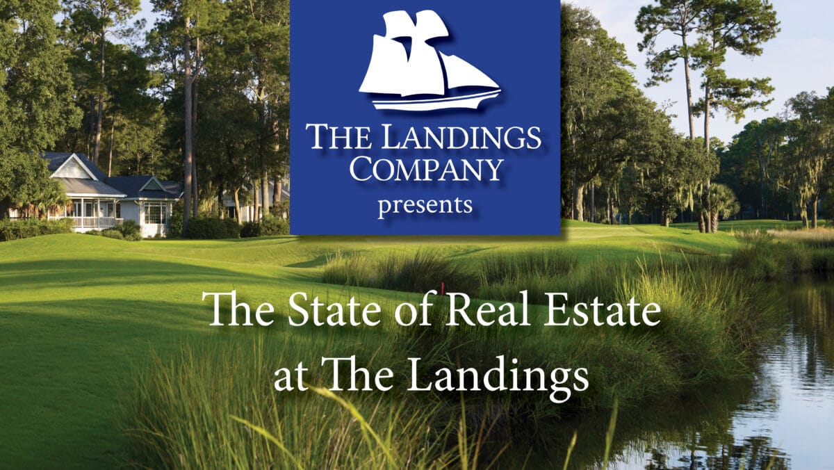 A calm lagoon with lush lawn and beautiful home in the background is part of the real estate landscape at The Landings.