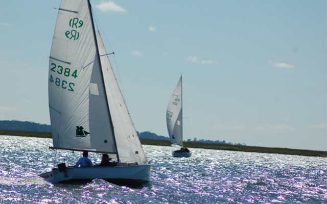 Two sailboats making way on the Georgia Intracoastal as members of the Landings Rhodes 19 Sailing Club.