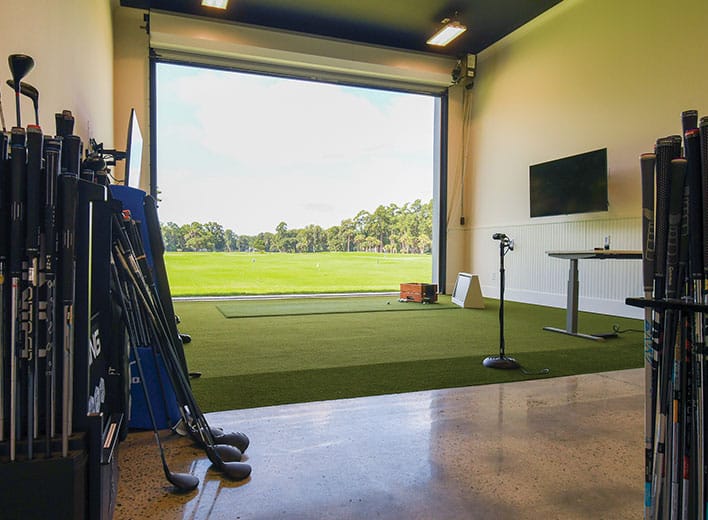 The indoor golf performance center is set up for club fittings and instruction.