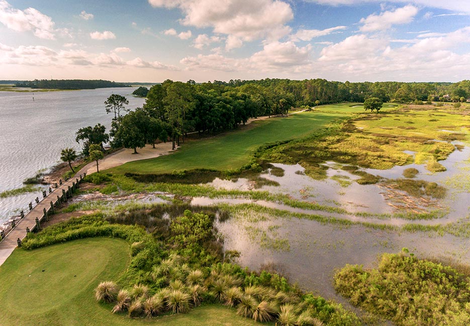 An Oakridge golf course fairway cuts through marshland on the right and the Intracoastal on the left. The course was designed by Arthur Hills.