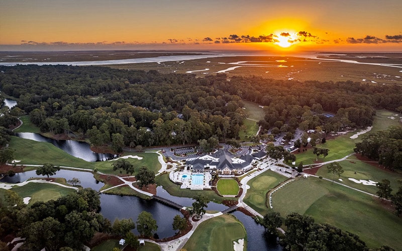 The sun sets on The Landings Golf & Athletic Club offering championship golf courses, swimming pools, tennis and pickleball courts and plenty of dining options.