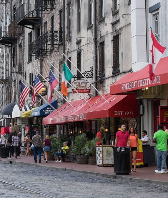Red awnings on buildings located in Savannah's historic downtown district.
