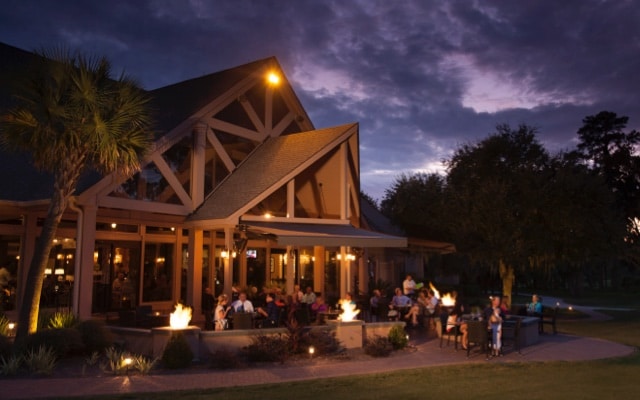 Diners enjoy a casual outdoor patio dining experience at the Deer Creek Coastal Grill.