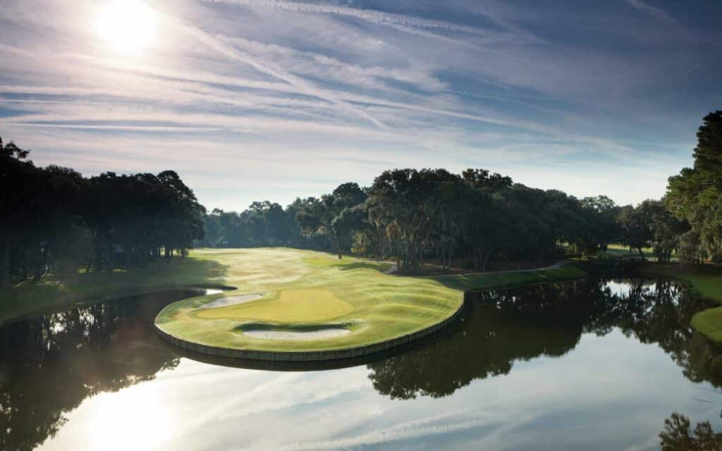 The high afternoon sun illuminates a lagoon wrapping around one of the challenging holes of the Palmetto golf course.