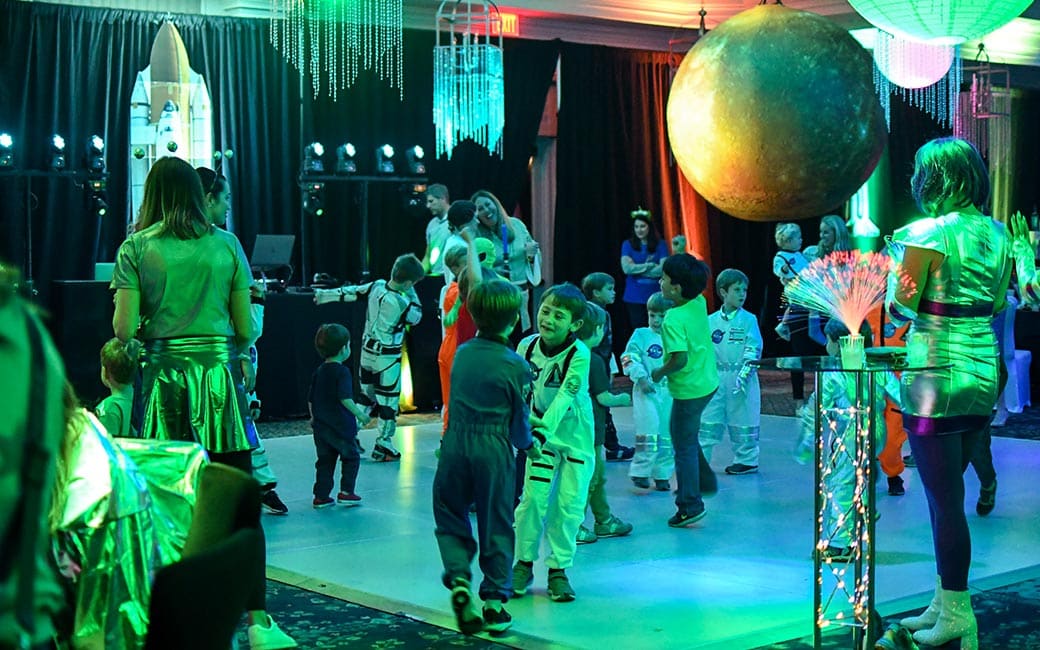 A dozen children gather on the dancefloor at a recent birthday party.